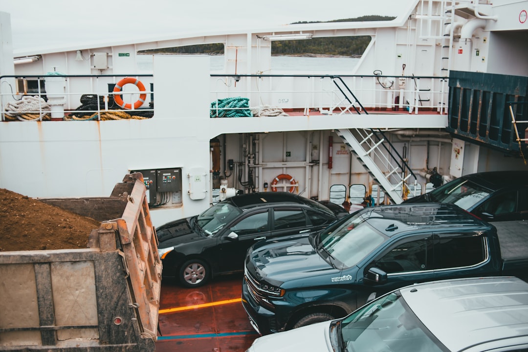 cars parked in front of building during daytime